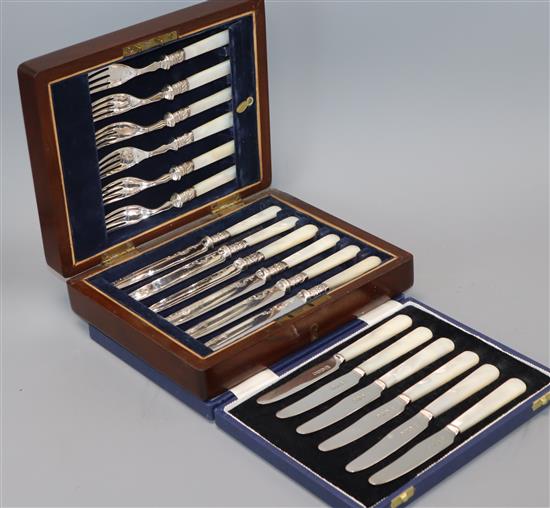A cased set of silver tea knives and cased dessert knives and forks